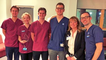 Students gathered with the award winner