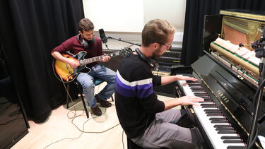 playing instruments guitar and piano 