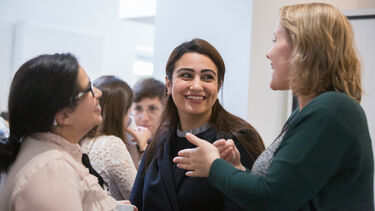 PhD students at a social event in the Doctoral Centre