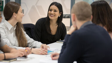 Four students working on a group project