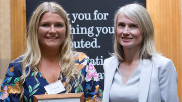 Elise McDonald receiving her Dean's List award from Professor Rachael Finn