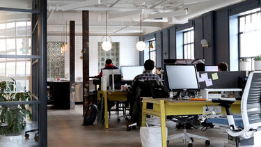 People sat in an office working at their desks