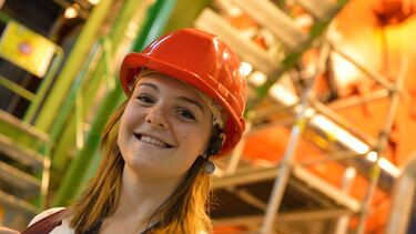 A student wearing a hardhat.