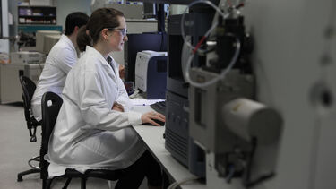 A researcher works at a chromatography station