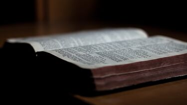 A bible laying open on a table