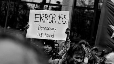 Image of woman protesting about democracy