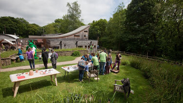 Members of the public talking to students at the Woodland Heritage Festival