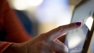 Person using a touchscreen tablet