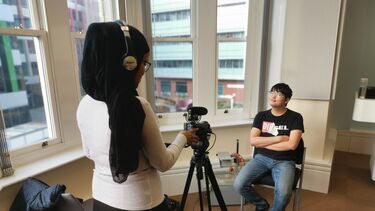 Students operating camera