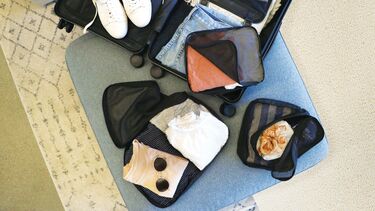 Image of suitcase being packed