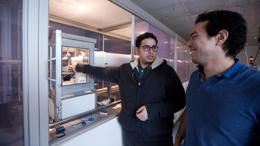 Postgraduate chemistry students using equipment: Polymers