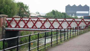 Bridge over the River Don with footpath and wild flowers. 