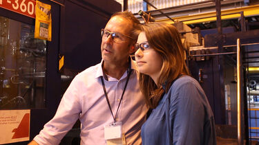 A female student with a male engineer