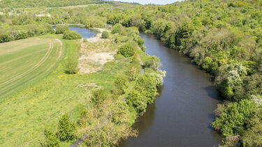 A photograph taken from Conisbrough Viaduct looking over the River Don towards Sprotbrough.