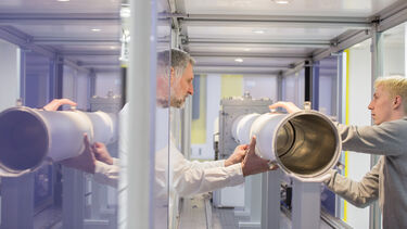 Researchers building a SAXS instrument.