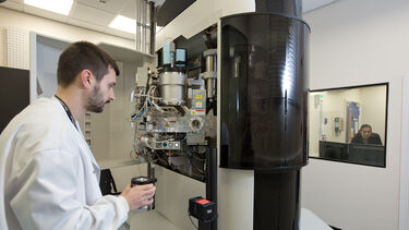 Student taking sample to cryo-electron microscope
