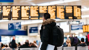 Image of a student in a train station