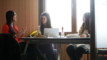 Postgraduate students talking