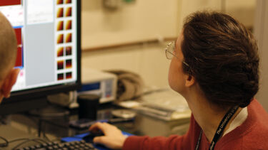 An image of Alice Pyne viewing the AFM results