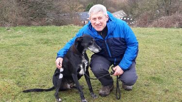 Andrew out on a walk with his dog