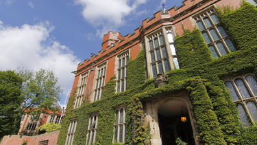 Exterior shot of Firth Court with lots of greenery. 