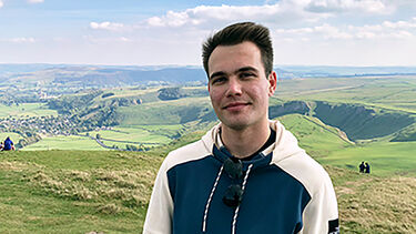 A headshot of Marton outside.