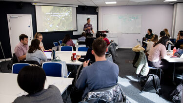A lesson happening in the School of Health and Related Research. This image is taken from the back of the classroom. 