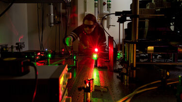 A researcher in the optics laboratory
