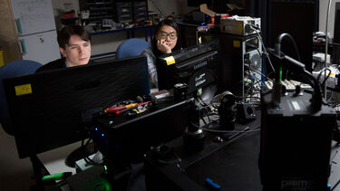 Researchers in the optics lab