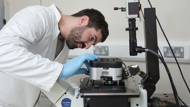 A researcher using an atomic force microscope