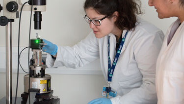 Researchers using an atomic force microscope