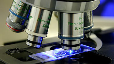 A close-up photo of a small microscope.