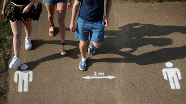 Young people waling 2m apart