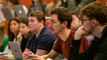 A student asking a question at the BBC Careers talk. 