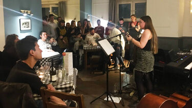 French students and staff during their music evening