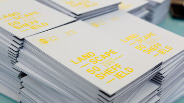 A stack of Landscape50 brocures