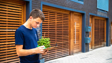 Student writes notes at new housing development in Sheffield
