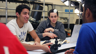 Mechanical Engineering students performing an experiment