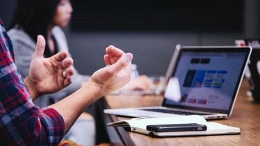 Man and woman in a meeting.