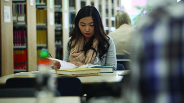 An image of a reader with a book