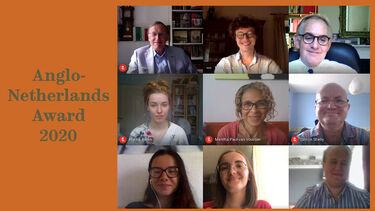 Students and staff with member of Anglo Netherlands society 