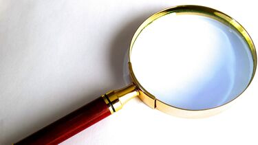 Magnifying glass on white background