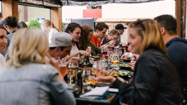 People eating a meal around a table