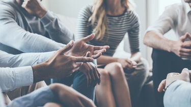 Student sat round discussing their concerns