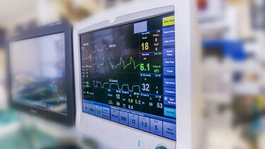 Computer monitors in the operating theatre during heart valve replacement surgery