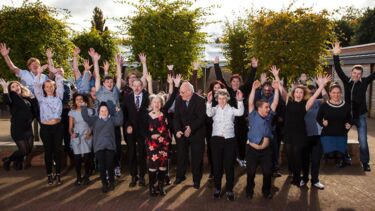 A group of people jumping 