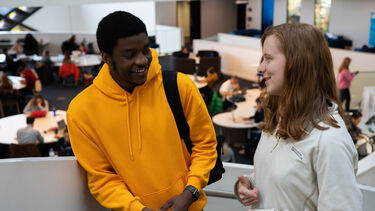 two computer science students chatting in the Diamond.