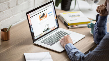 person researching at a laptop