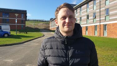 Ben Lewis standing on road