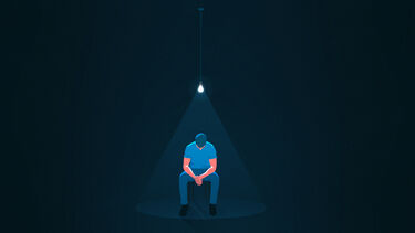 person sat in police custody graphic